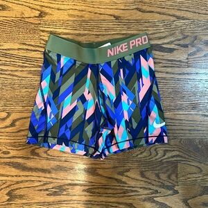 Nike: girls Nike pros dri-fit, multi colored, size medium.